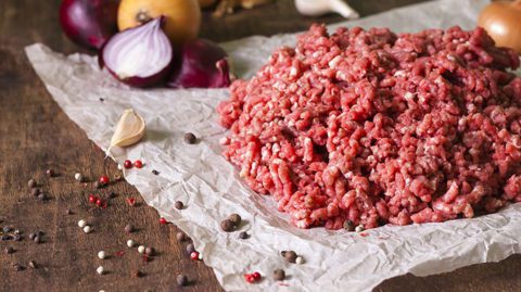 Ground beef with garlic and onions on paper