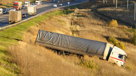 large truck in ditch