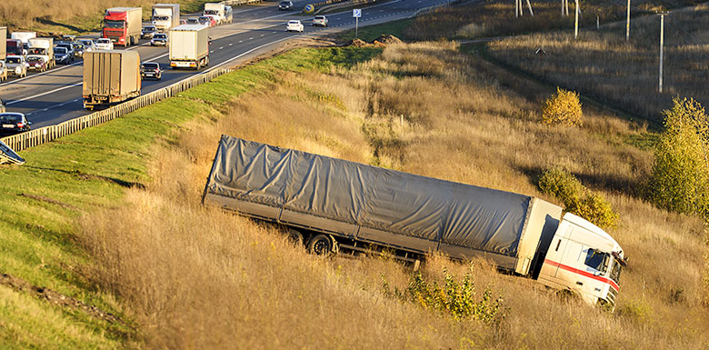 large truck in ditch