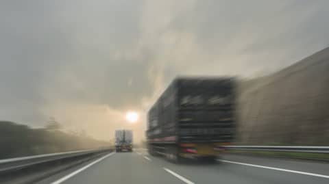 Trucks driving in foggy weather