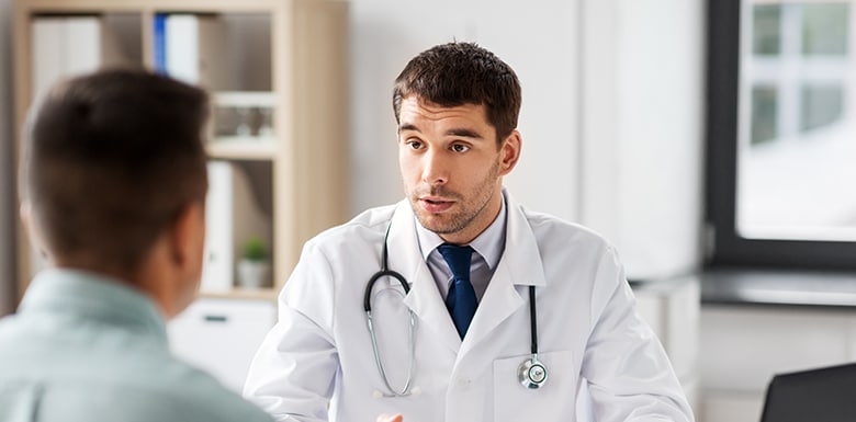 Doctor talking to his patient image