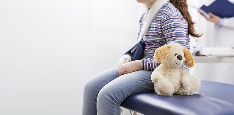 Injured child with Teddy bear image