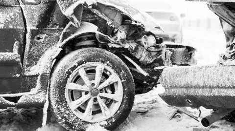 Wrecked cars during a winter storm