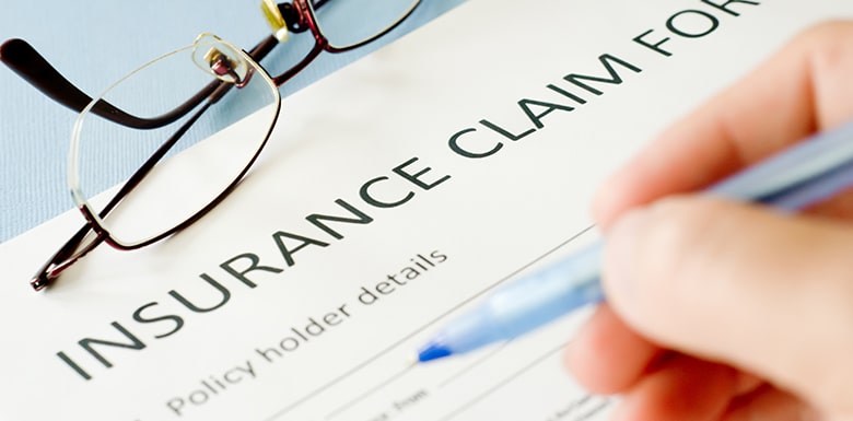 Filling out insurance claim form image