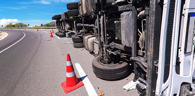 Semi truck overturned on road