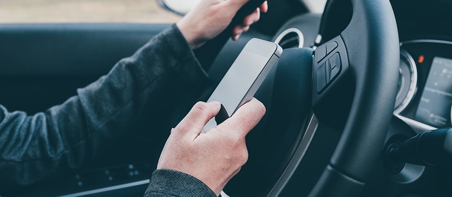 Person on their phone while driving