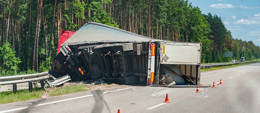 Semi-truck rollover accident on highway