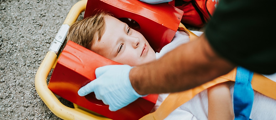 Child on a gurney after an accident